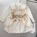 Stunning luxury puffball coat with bows and detailing on back