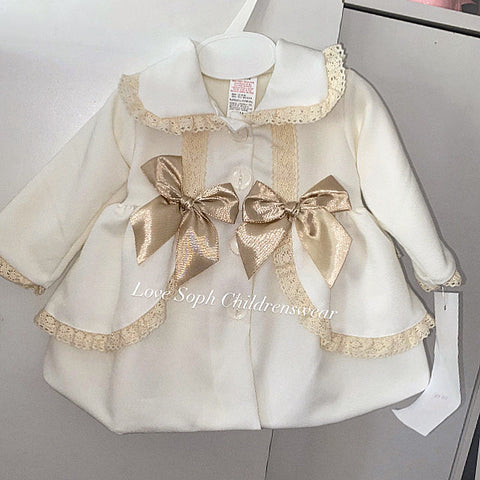 Stunning luxury puffball coat with bows and detailing on back