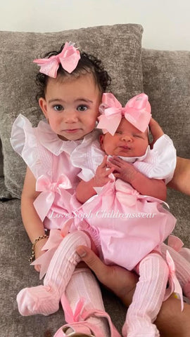 Smocked frill sleeved romper pink