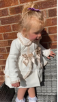 Stunning luxury puffball coat with bows and detailing on back