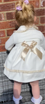Stunning luxury puffball coat with bows and detailing on back