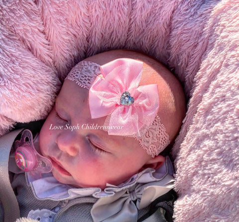 Floral lace headband with bow and gem