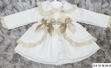 Stunning luxury puffball coat with bows and detailing on back
